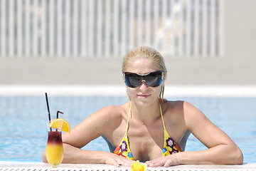 Image showing beautiful woman relax on swimming pool