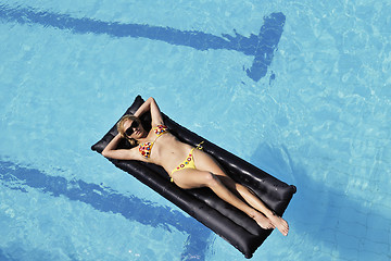 Image showing beautiful woman relax on swimming pool