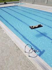 Image showing beautiful woman relax on swimming pool