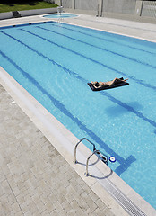 Image showing beautiful woman relax on swimming pool