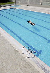 Image showing beautiful woman relax on swimming pool