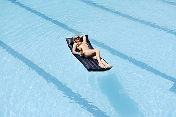 Image showing beautiful woman relax on swimming pool