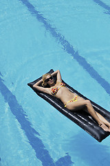 Image showing beautiful woman relax on swimming pool