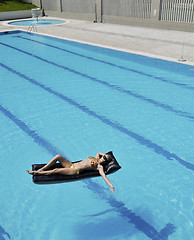 Image showing beautiful woman relax on swimming pool