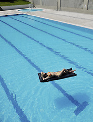 Image showing beautiful woman relax on swimming pool