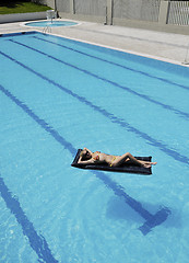 Image showing beautiful woman relax on swimming pool