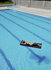 Image showing beautiful woman relax on swimming pool