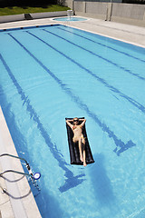 Image showing beautiful woman relax on swimming pool