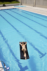 Image showing beautiful woman relax on swimming pool