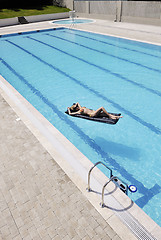 Image showing beautiful woman relax on swimming pool