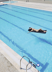 Image showing beautiful woman relax on swimming pool