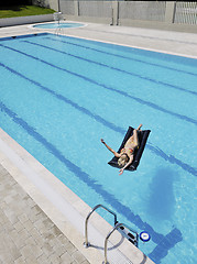 Image showing beautiful woman relax on swimming pool