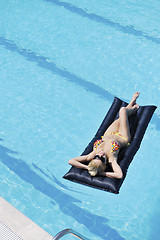 Image showing beautiful woman relax on swimming pool