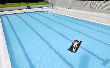 Image showing beautiful woman relax on swimming pool