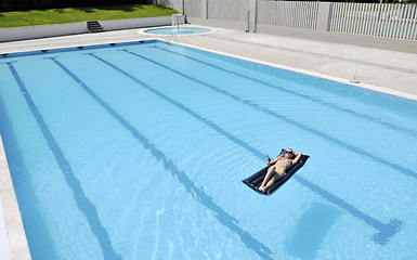 Image showing beautiful woman relax on swimming pool