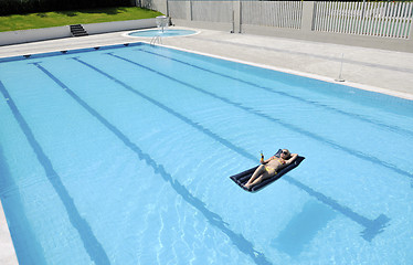 Image showing beautiful woman relax on swimming pool