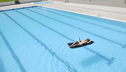 Image showing beautiful woman relax on swimming pool