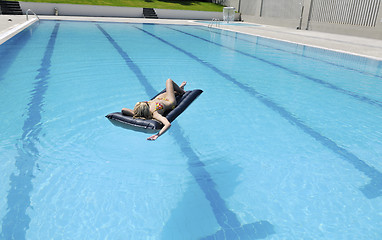 Image showing beautiful woman relax on swimming pool