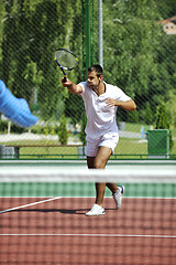 Image showing young man play tennis outdoor