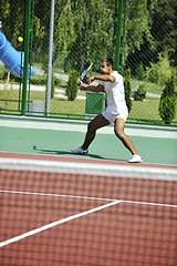 Image showing young man play tennis outdoor