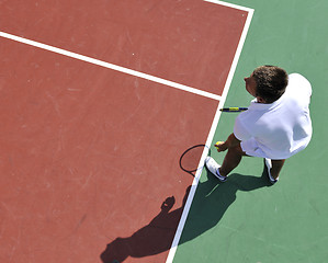 Image showing young man play tennis outdoor