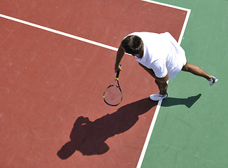 Image showing young man play tennis outdoor