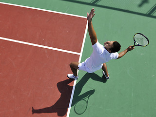 Image showing young man play tennis outdoor