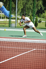 Image showing young man play tennis outdoor