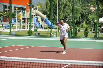 Image showing young man play tennis outdoor