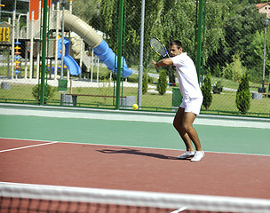 Image showing young man play tennis outdoor