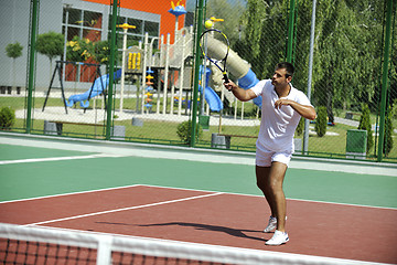 Image showing young man play tennis outdoor