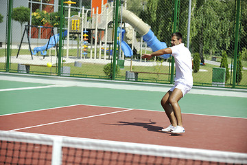 Image showing young man play tennis outdoor