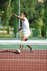 Image showing young man play tennis outdoor