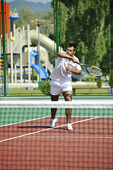 Image showing young man play tennis outdoor