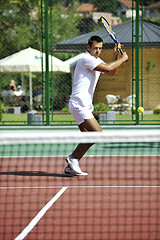 Image showing young man play tennis outdoor