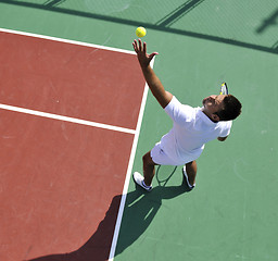 Image showing young man play tennis outdoor