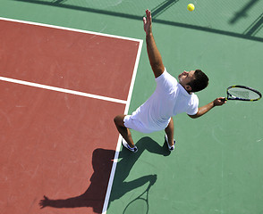 Image showing young man play tennis outdoor