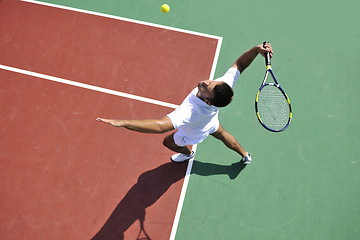 Image showing young man play tennis outdoor