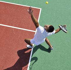 Image showing young man play tennis outdoor