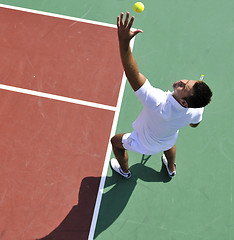 Image showing young man play tennis outdoor