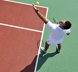 Image showing young man play tennis outdoor