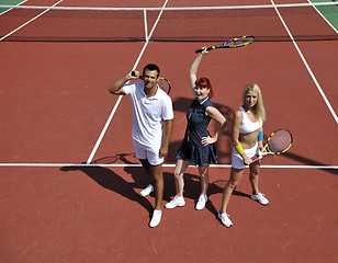 Image showing happy young couple play tennis game outdoor