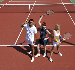 Image showing happy young couple play tennis game outdoor