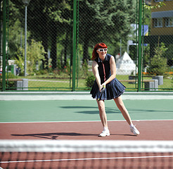 Image showing young woman play tennis game outdoor