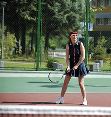 Image showing young woman play tennis game outdoor