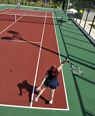 Image showing young woman play tennis game outdoor