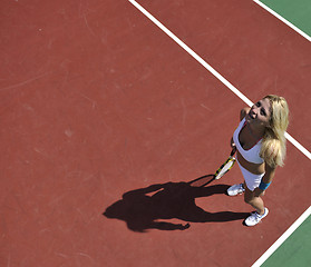 Image showing young woman play tennis game outdoor