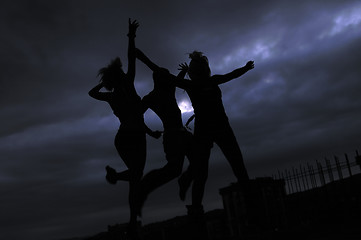 Image showing teens jumping in air ready for party
