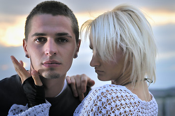 Image showing romantic urban couple dancing on top of  bulding