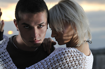 Image showing romantic urban couple dancing on top of the bulding 